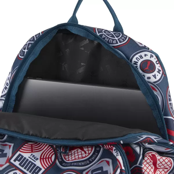  Раница PUMA ACADEMY AOP BACKPACK 09115027 MIDNIGHT PETROL/FOR ALL TIME RED/RUNNING BADGES AOP 
