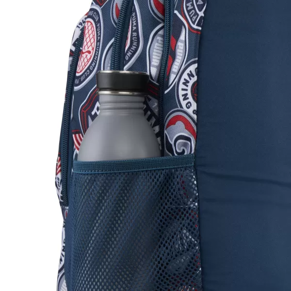  Раница PUMA ACADEMY AOP BACKPACK 09115027 MIDNIGHT PETROL/FOR ALL TIME RED/RUNNING BADGES AOP 